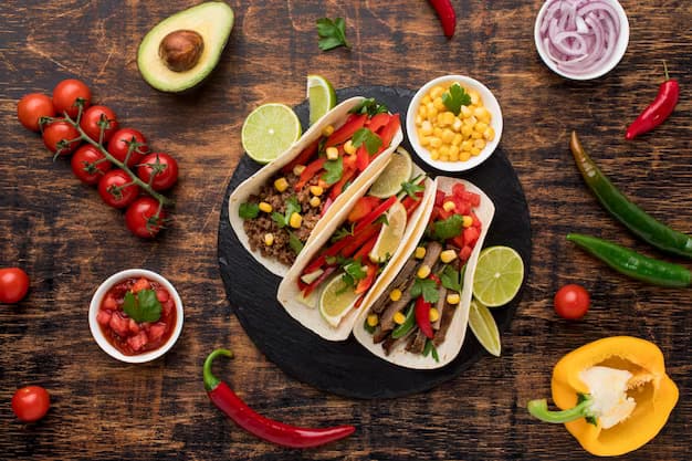 Tacos on wooden table with vegetables