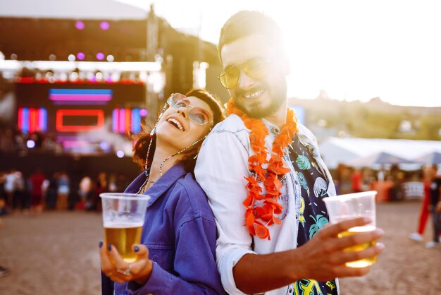 Couple with beer at music festival