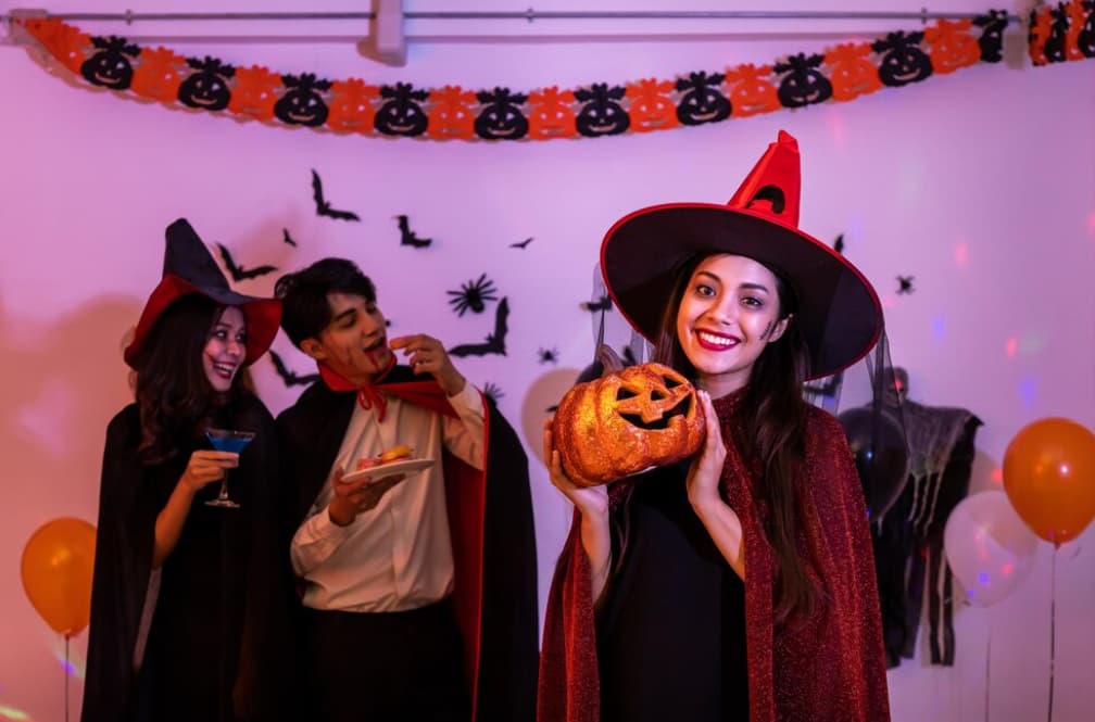 People in Halloween costumes enjoying a themed party