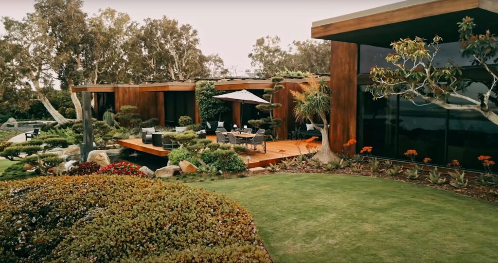 Green lawn with a terrace near the house