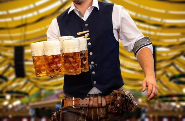 Waiter serving beer close-up