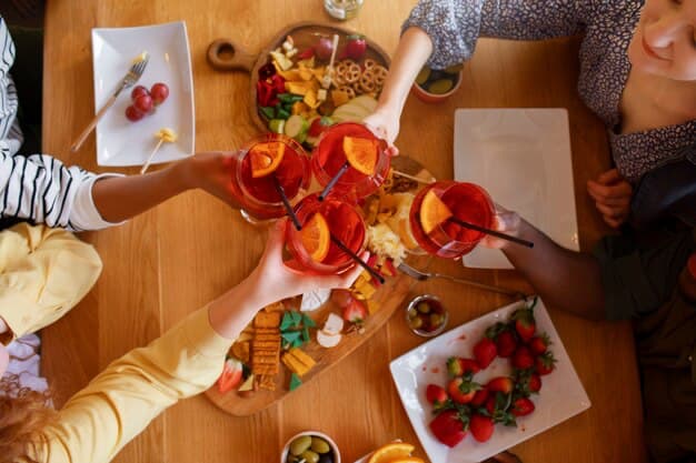 People sitting at the table having dinner and drinking drinks